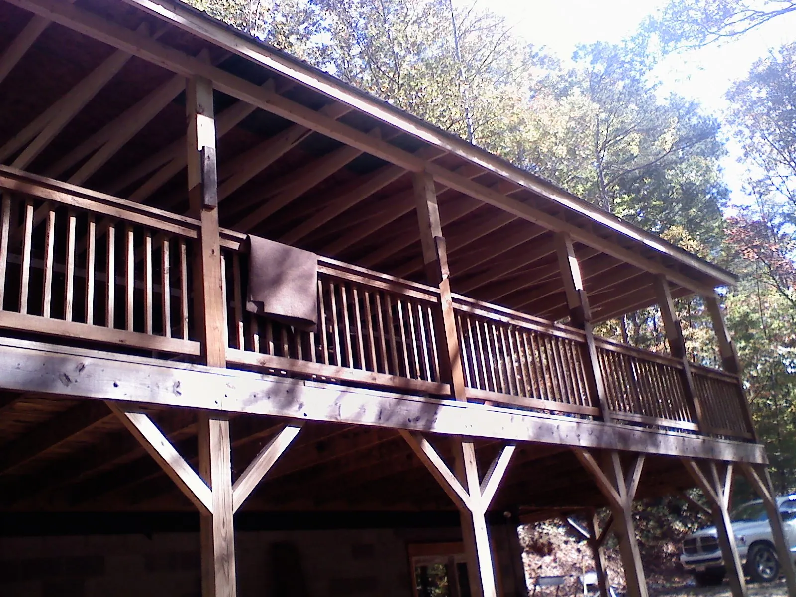 Timber framing under a new elevated porch and deck — Roof Leak Repair in Elora by Roofing Brothers